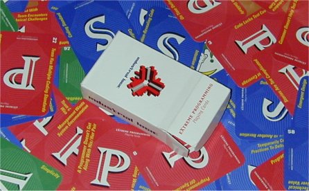 red, green, and blue cards underneath an open box