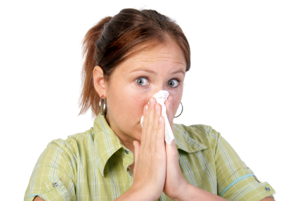 A person blowing their nose into a tissue