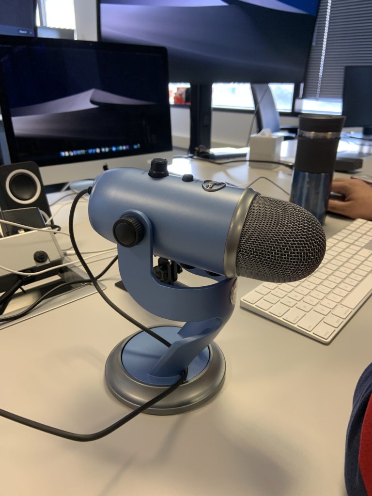 microphone in foreground of work desk